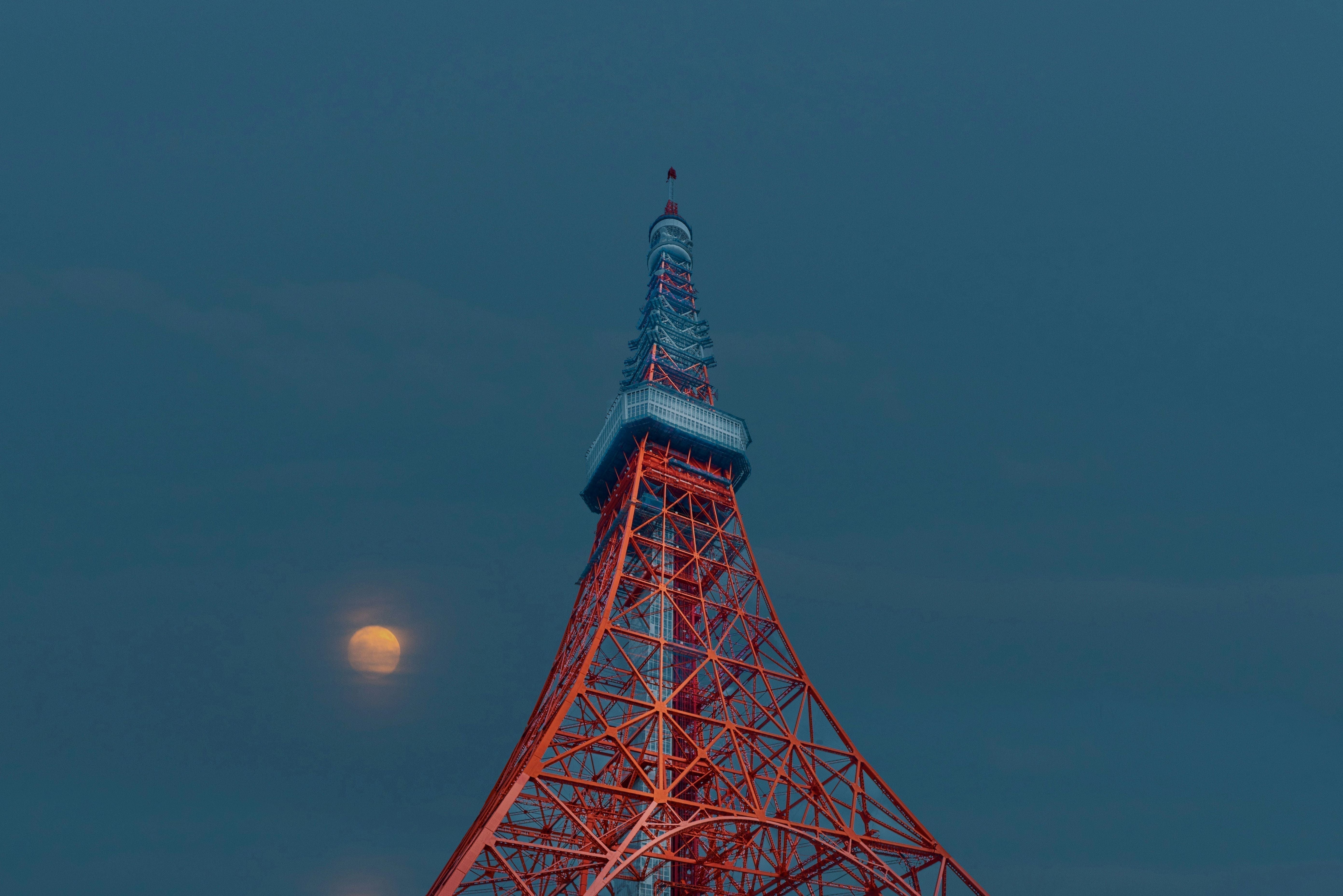 Full moon rising above Tokyo Tower